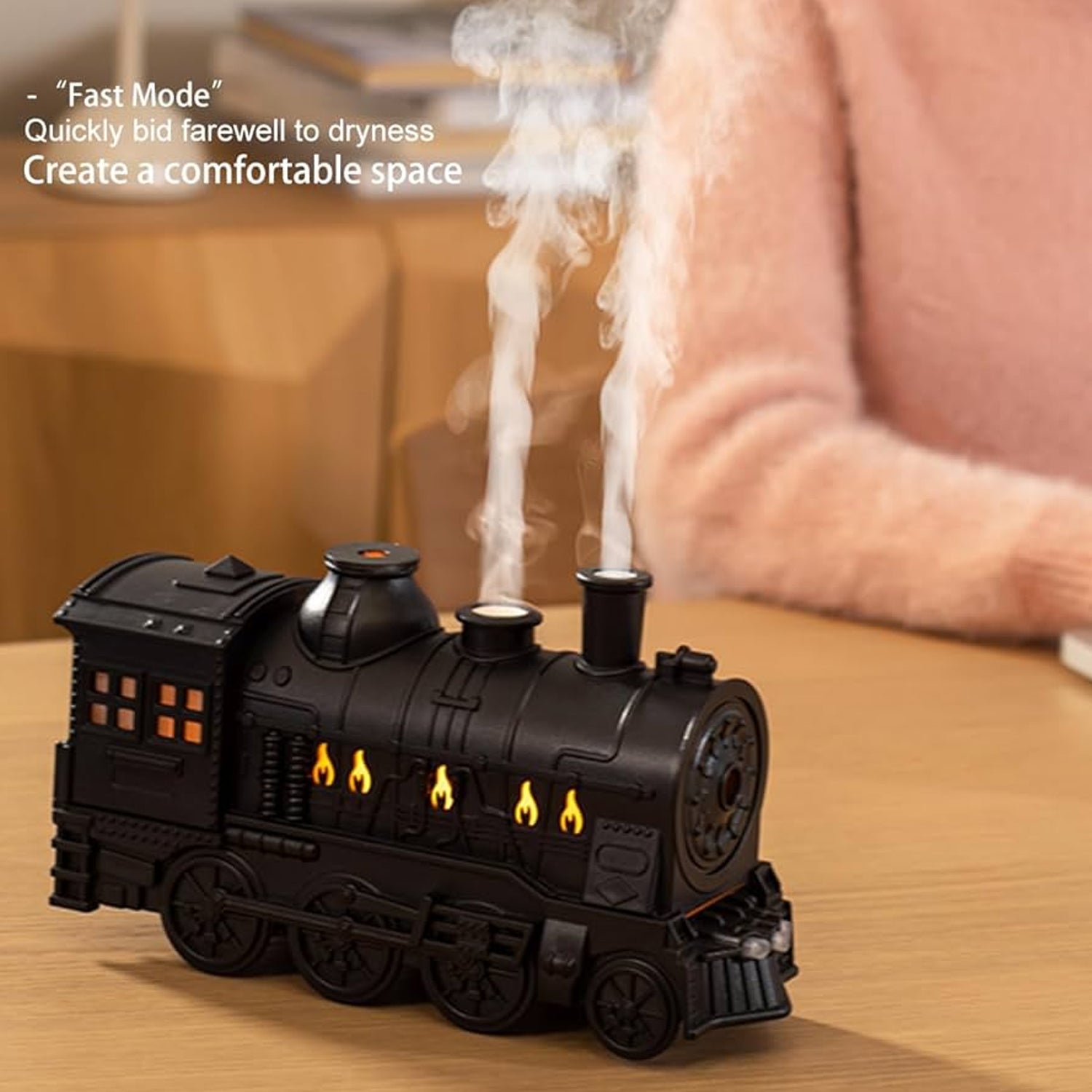 Portable mini humidifier with retro train aesthetic and mist output