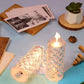 Flameless rose candle with a clear acrylic base, ideal for festive decorations.
