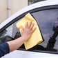 Magic Cleaning Towel cleaning a car dashboard, illustrating its effectiveness for car detailing.