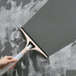 Detaching the refillable spray bottle from the cleaning brush for easy refill.