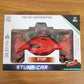 Wireless remote control placed beside stunt car toy