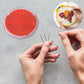 Close-up of needle threader tool in the sewing kit