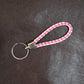 Stylish braided leather style keychain accessory with durable metal ring