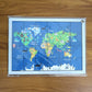 Interactive wooden world map puzzle for kids, promoting hands-on learning.