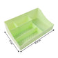 Workspace with green desk organizer storage tray and stationery inside