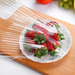 Hand stretching a reusable elastic food cover to demonstrate its flexibility and universal fit.