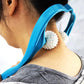 Woman experiencing deep relaxation with the neck and shoulder massager at home.
