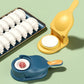 The manual dumpling press machine creating perfectly shaped dumplings.