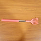 Khujli Stick back scratcher with its product packaging and included accessories.