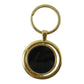 Modern gold plated keychain with black rotating pendant, ideal for gifting.