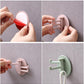Another view of the 180° foldable sticky hook, showcasing its use in kitchen and bathroom.