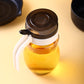 650ml plastic oil dispenser with sleek design for kitchen use.