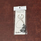 Display of durable metal Shivling keychain with snake design