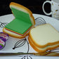 Creative display of sandwich sticky notes used as fun stationery items.