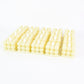Decorative table setting illuminated by warm LED flameless cube candles
