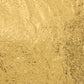 Close-up of a self-adhesive golden kitchen foil sticker roll.