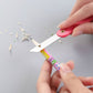 Vibrant multicolour handle of a mini paper cutter knife showing ergonomic design.