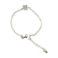 Detailed view of square stone charm on adjustable chain bracelet