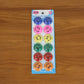 Multicolored smiley face magnetic buttons arranged in set