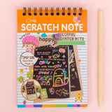 A child's hand scratching a rainbow art scratch book, revealing vibrant colours.