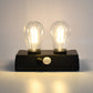 Indo Glow Solar Double LED Lamp providing ample light for an outdoor area.