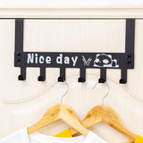 Panda over door hook rack organizing towels on a white door, showcasing practical use.