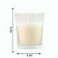 The Sweet Dreams Scented Votive Candle creating a serene ambiance on a bedside table.