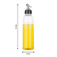 Hand pouring oil from the 1 litre transparent plastic oil dispenser with precise control.