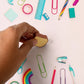 Toast bread erasers displayed with other school supplies on a colorful background.