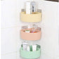 Plastic storage rack with convenient hanging hooks for kitchen or bathroom use.