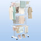 Compact foldable clothes drying rack shown partially folded for storage.