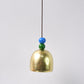 Close-up of metallic outdoor dragonfly wind chime with vibrant colors