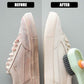 Cleaning brush in action, scrubbing clothes with integrated soap dispenser.