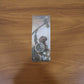 Close-up detail of metal hammer shape on keychain