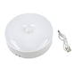 Round LED light with motion sensor capability, perfect for dark corners and storage areas.