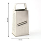 Box-style stainless steel grater placed on kitchen counter for food preparation.