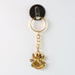 Side angle of Ganesh Leaf design keychain in golden metal