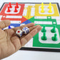 Children playing the portable Ludo board game together, enjoying family fun.