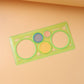 Complete spirograph ruler set with various shape guides and measurement markings