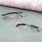 Protective case storing lightweight rimless reading glasses for travel