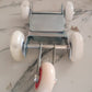 Garage tool for motorcycle front wheel repositioning and parking