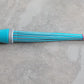 Plastic broom for effective cleaning, highlighting its stiff bristles and base.