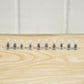 Set of black tire repair nails for vehicles