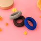 Tyre shape multicolour hair bands in a pack of three, displayed for women.
