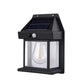 Hand holding a Solar Wall Lamp to show its compact size and design.