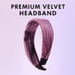 Woman using padded ribbed knot hairband for makeup and styling