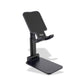 Person using the desktop tablet stand for hands-free video viewing.
