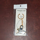 Packaging detail of golden Shivling keychain