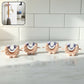 Close-up view of wall mounted broom and mop holder clip