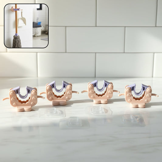 Close-up view of wall mounted broom and mop holder clip